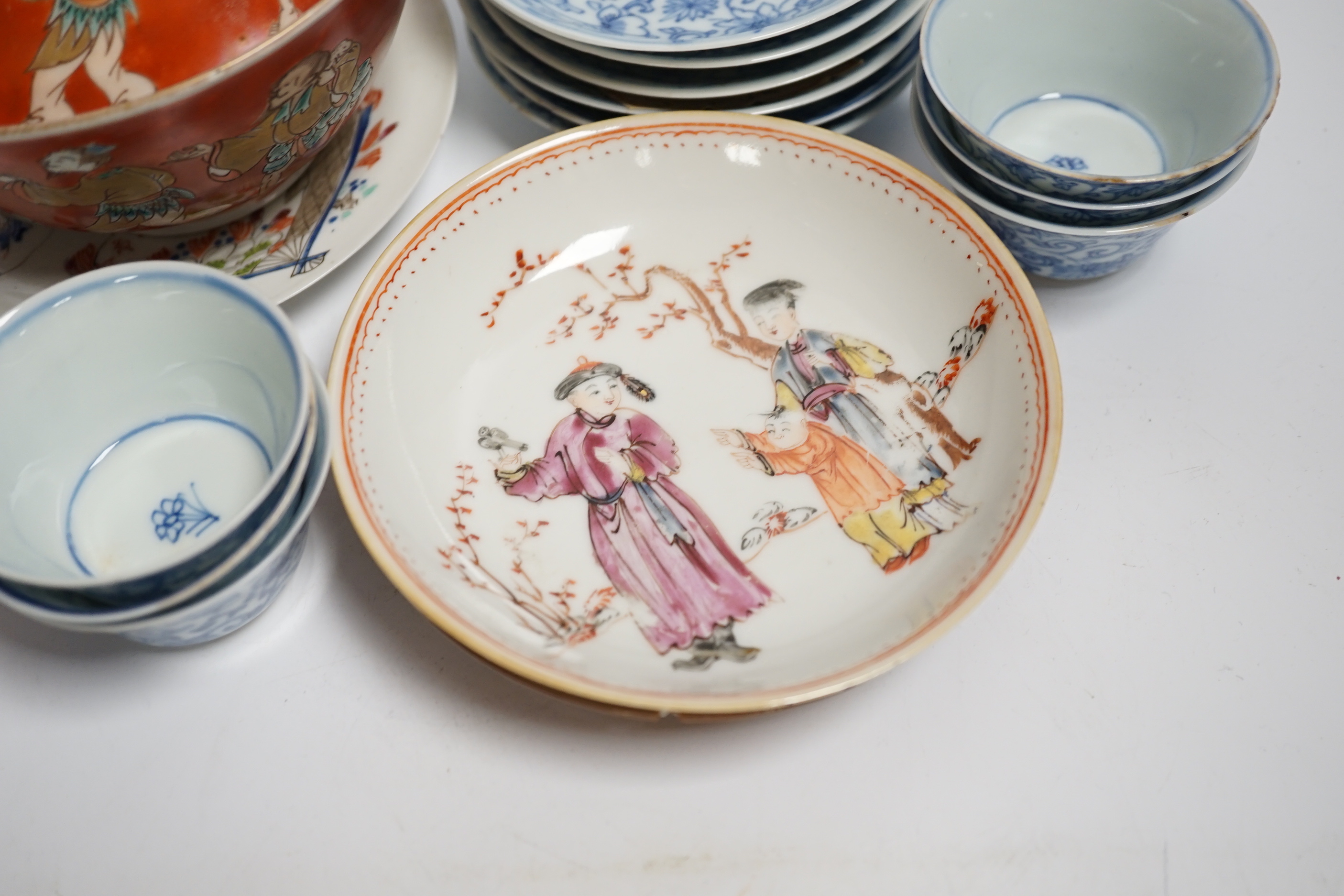 A set of six Chinese blue and white tea bowls and saucers, Kangxi period, a Chinese famille rose tea bowl and saucer, a Batavia ware saucer, both 18th century and Japanese ceramics